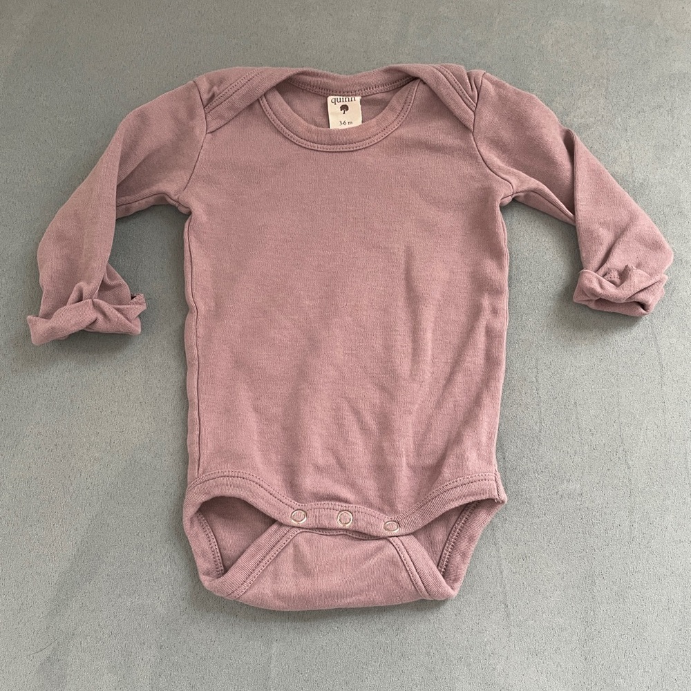 Kate Quinn cotton onesie